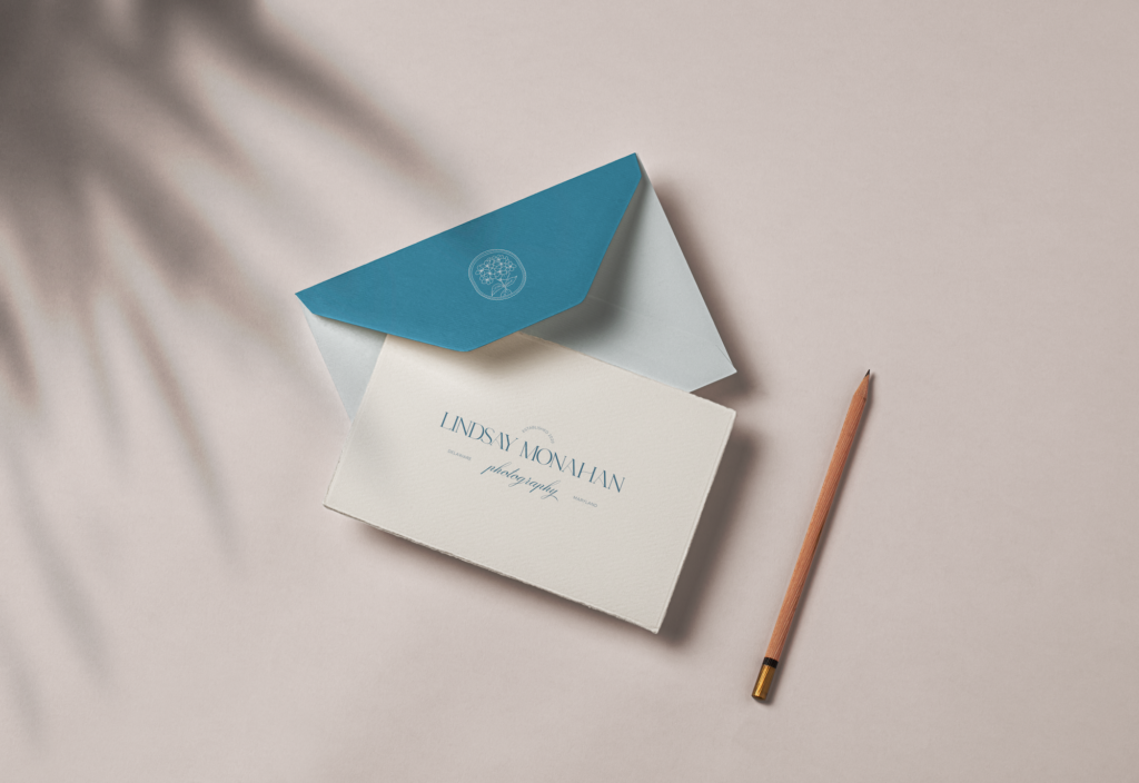 Lindsay's brand mark and logo on an envelope and piece of paper with pencil